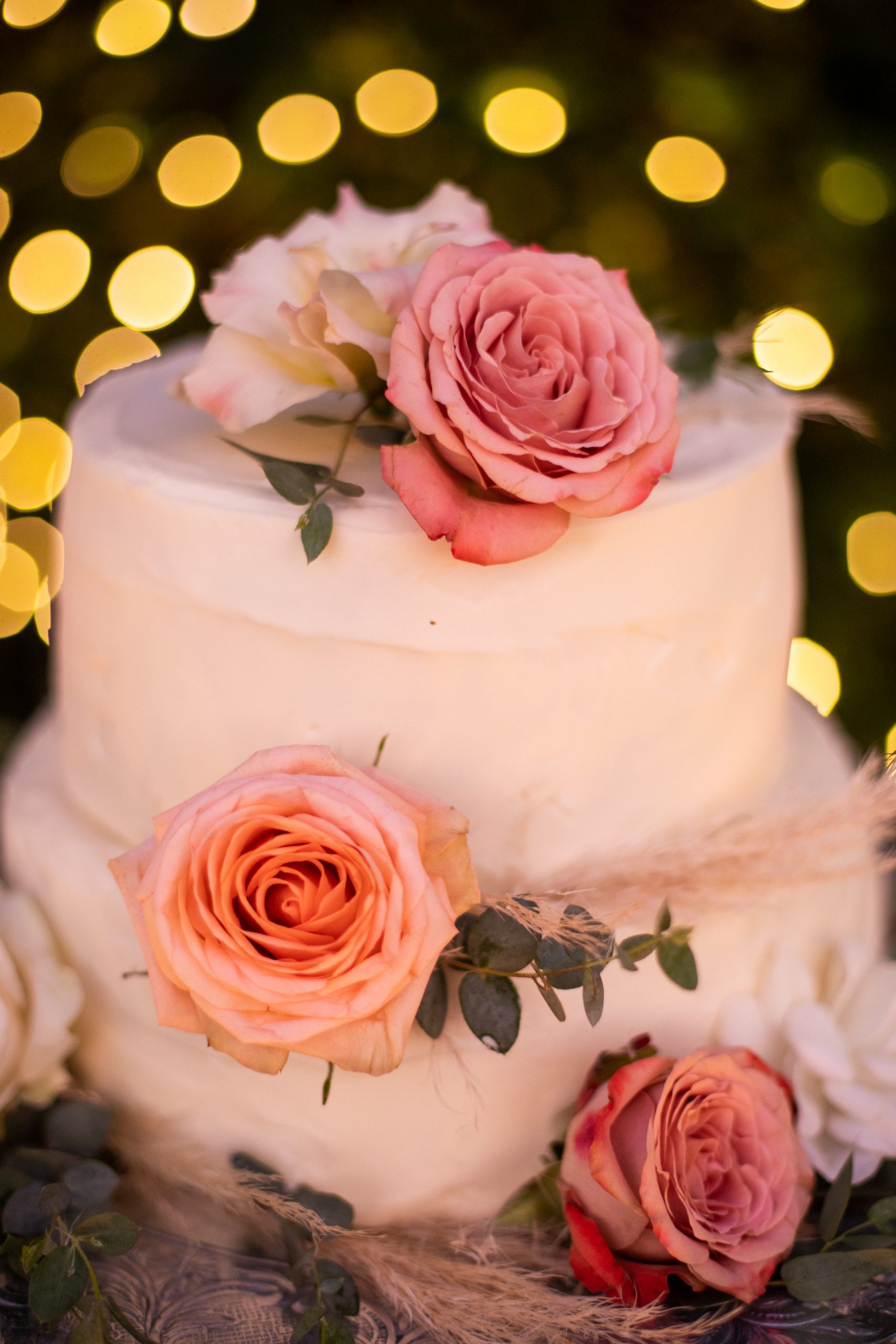 Wedding cake with pink roses.