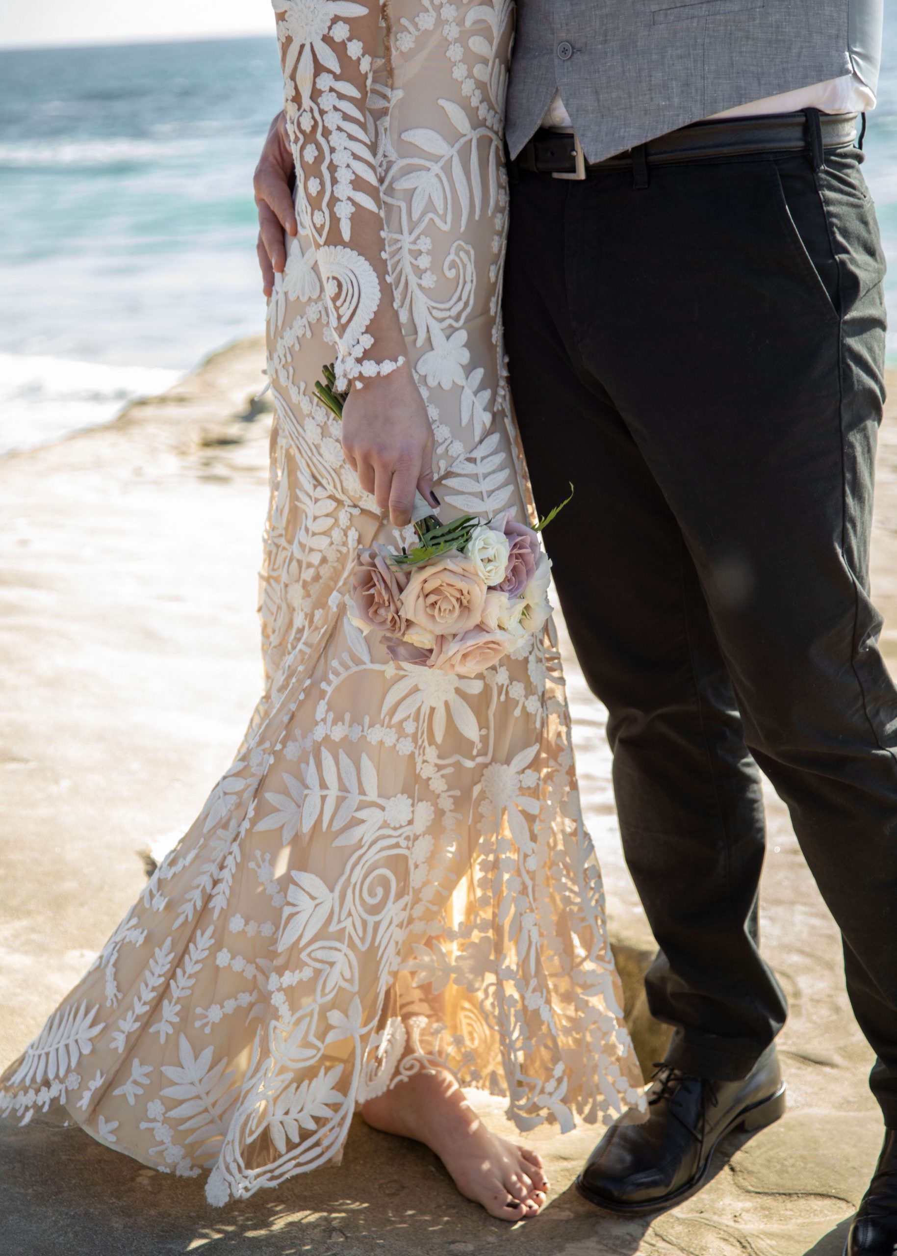 Bride and groom sunset portraits at Windansea Beach La Jolla, California.
