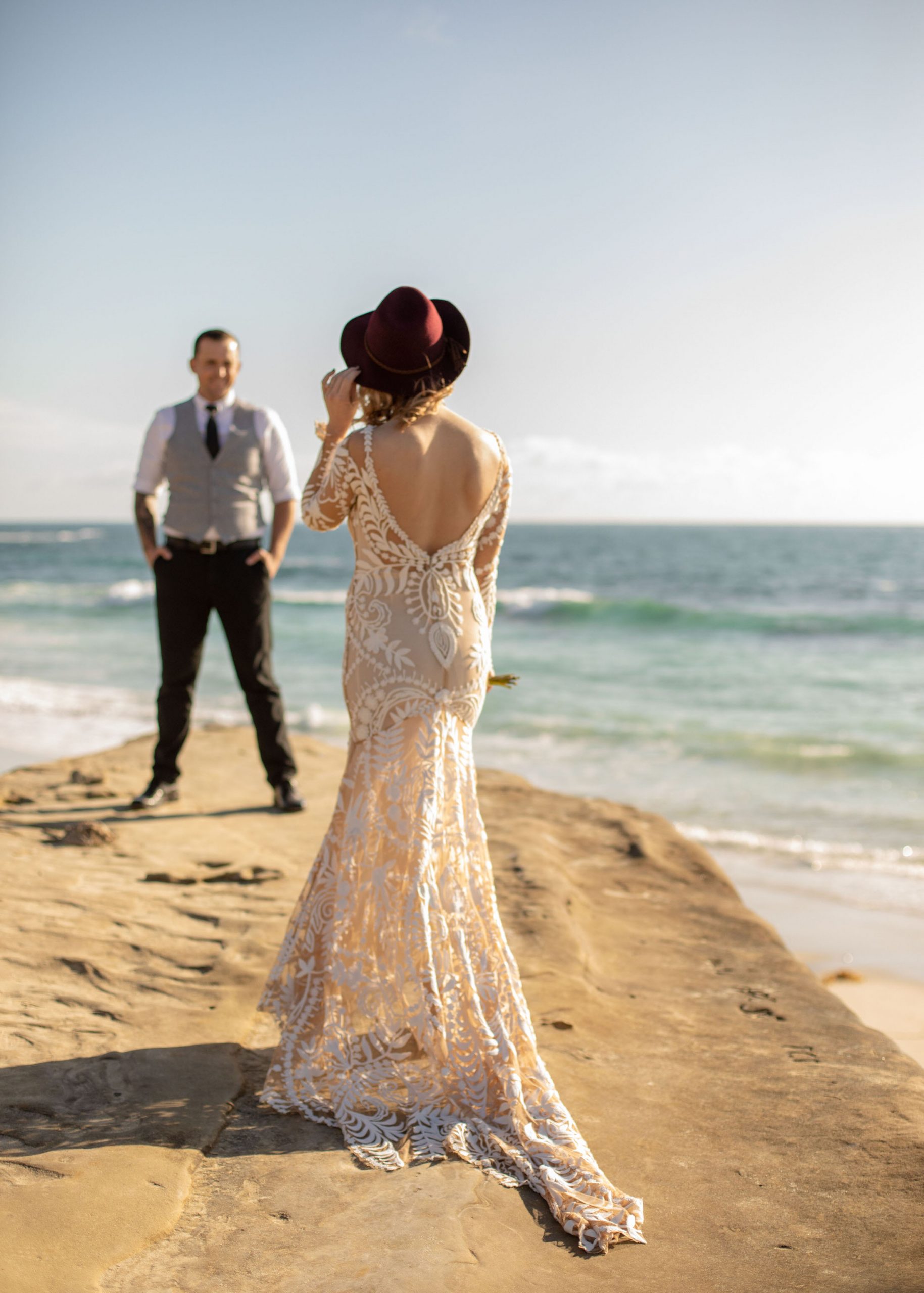 Bride and groom sunset portraits at Windansea Beach La Jolla, California.