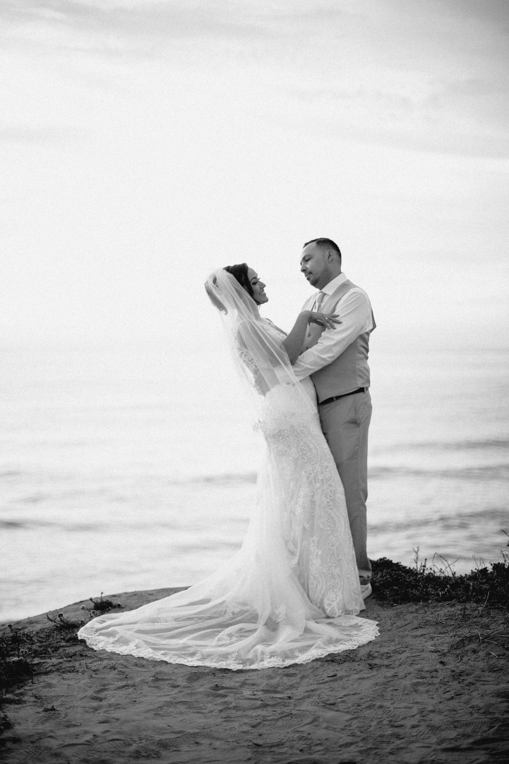 Bride and groom sunset portraits at Sunset Cliffs.