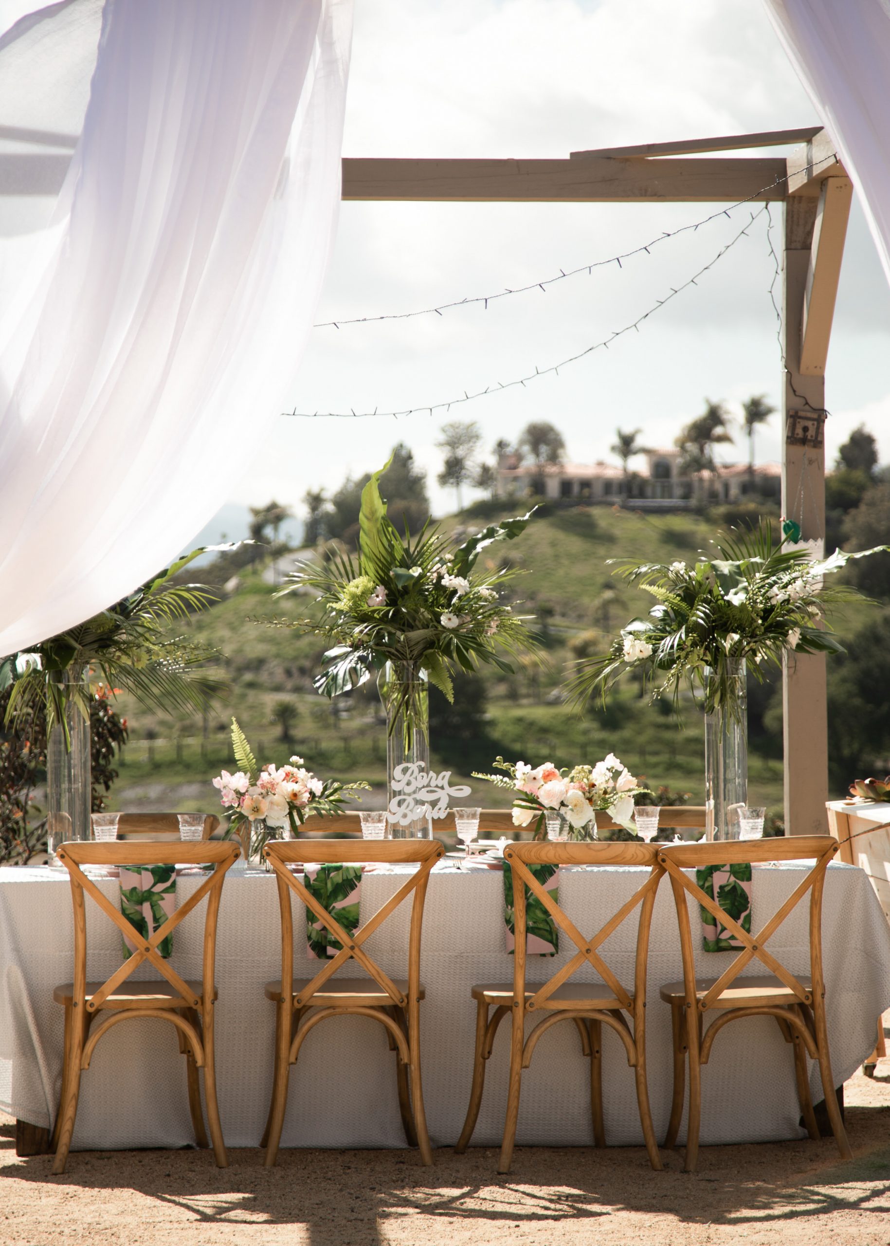 Tropical wedding table setting inspiration.