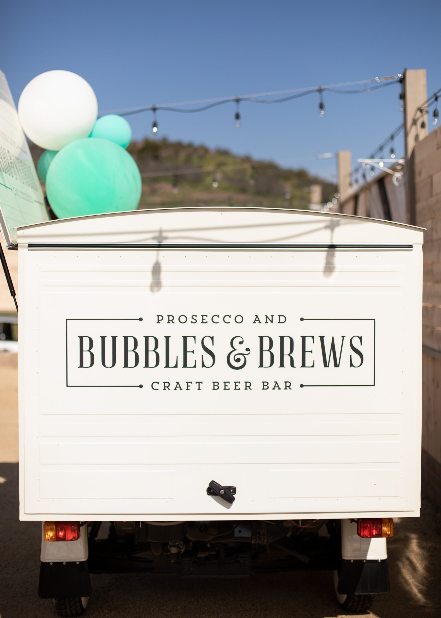 Bubbles and Brews, prosecco and craft beer bar signature cocktails during a tropical wedding in Temucula, CA.