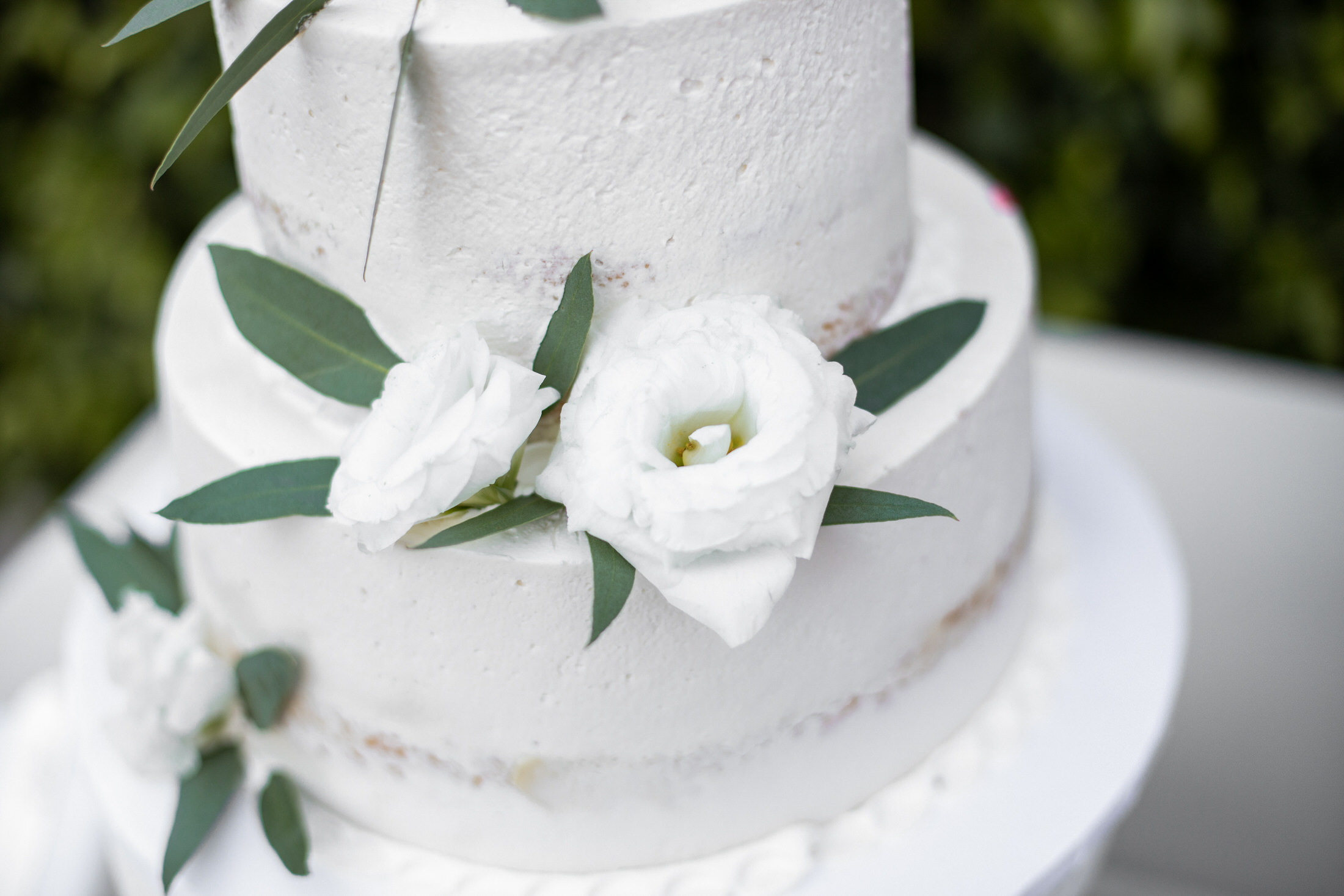 Simple, white wedding cake.