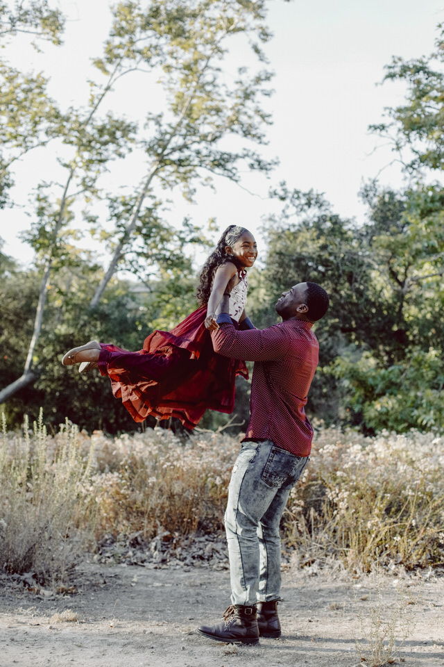A father and daughter dancing.