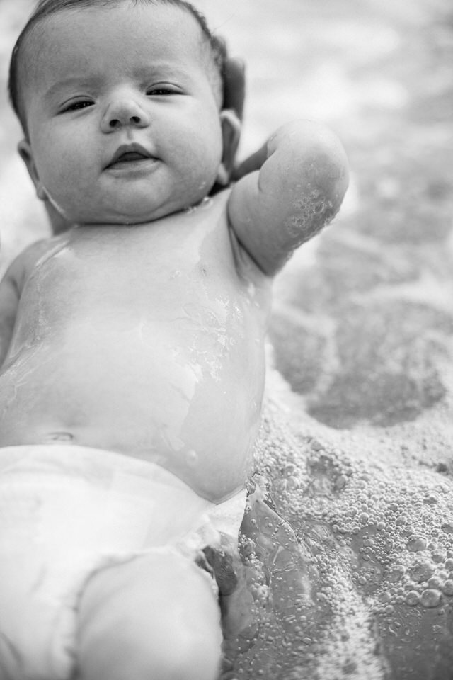 New born lifestyle photography in water.