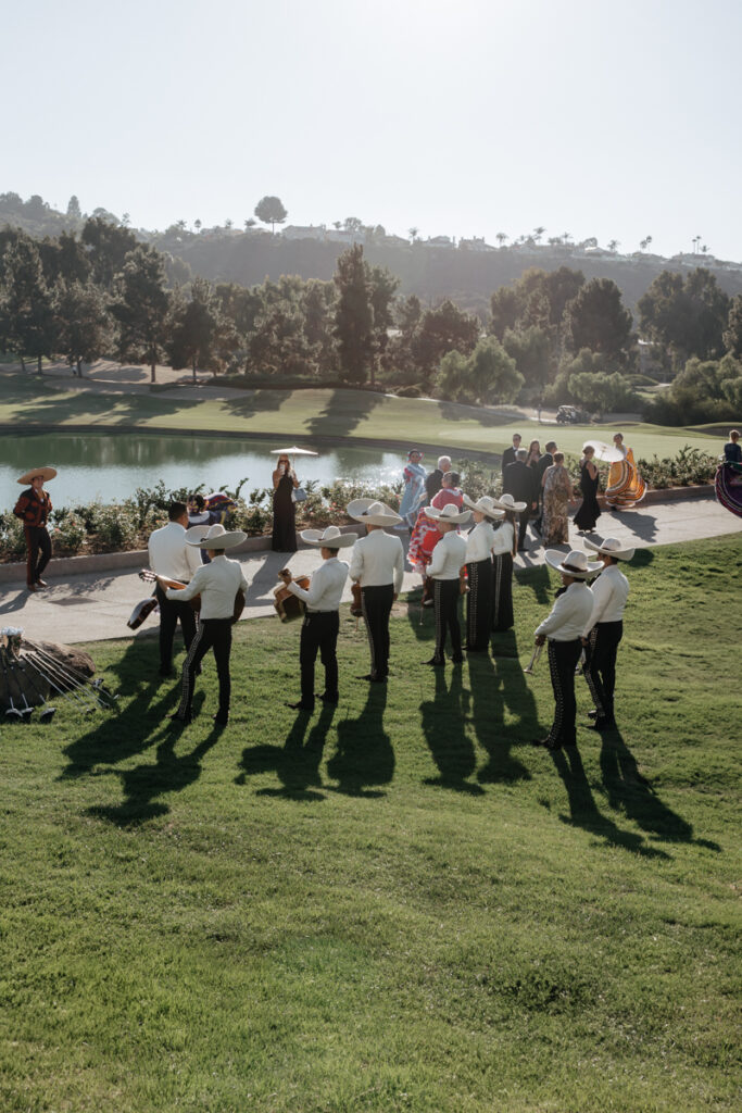 Mariachi band performing outdoors during wedding cocktail hour at Del Mar Country Club.