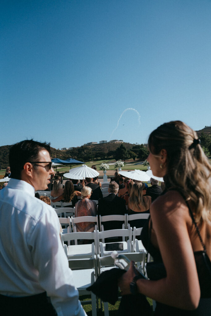 Guests chatting before outdoor ceremony at Del Mar Country Club.