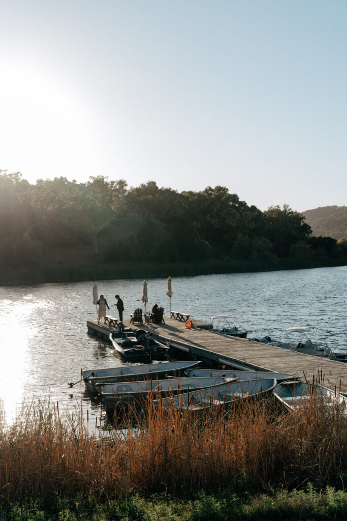 Dock and canoes at sunset on Alisal Ranch's private lake