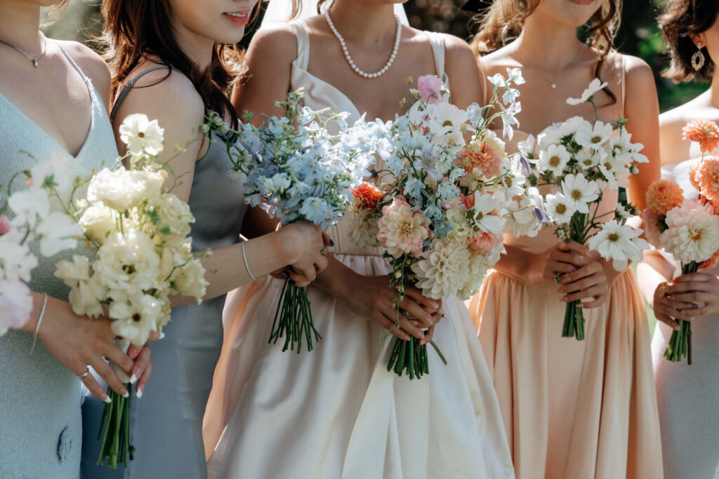 Close up of the bridesmaids holding their bouquets